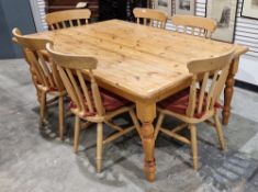 A large pine kitchen table and six pine chairs, the table with single drawer and turned legs, 78cm