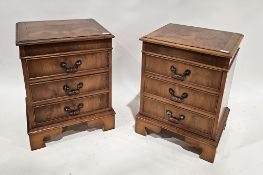 Pair of reproduction mahogany and burrwood veneered bedside chests, each with three drawers,