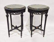 Pair of black painted circular occasional tables with green veined marble tops, the bases with