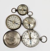 Four late 19th/early 20th century pocket compasses, two in brass cases and two silvered, three