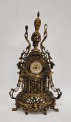 20th century German gilt metal mounted mantel clock, the pierced case surmounted with an urn finial,