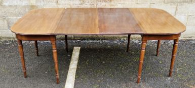 19th century mahogany extending D-end dining table with two additional leaves, raised on turned