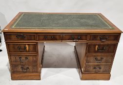 Reproduction mahogany veneer twin-pedestal desk having a green gilt tooled leather top and one
