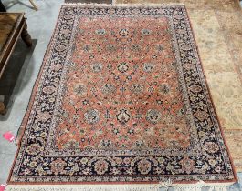 Large Eastern salmon ground rug with floral field to floral border, 279cm x 198cm Condition Report