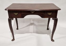 George II mahogany lowboy, the rectangular top with shaped corners, over one long and two short