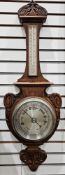 Early 20th century banjo barometer in ornately carved and decorated oak case, mercury thermometer,