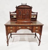 Victorian rosewood dressing table having a two-door cupboard to the top section with two bevelled