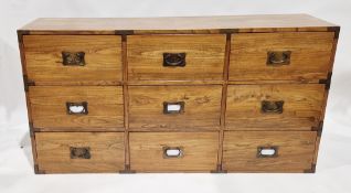 Oriental-style hardwood brass-bound chest of drawers comprising a bank of nine drawers, 90cm high