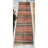 Eastern Mashad red ground wool runner with multiple geometric stripes, 277cm x 75cm