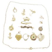 Selection of 9ct gold and yellow metal charms, to include a miniature ring, Squirrel and many