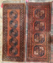 Two Afghani red ground runners, one with four central quartered elephant foot guls to multiple