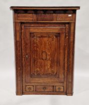 Georgian oak corner cupboard, the single panel door revealing three shelves, with three small