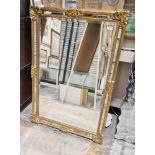 Reproduction gilt frame rectangular wall mirror with moulded scroll corners and bevelled plate, 94cm