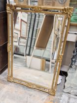 Reproduction gilt frame rectangular wall mirror with moulded scroll corners and bevelled plate, 94cm