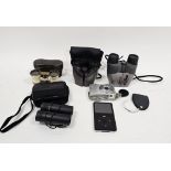 Pair of bone and brass opera glasses in leather case and a collection of modern binoculars, cameras,