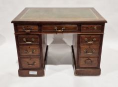 Mahogany pedestal desk, the central drawer flanked by eight short drawers, with leather inset to