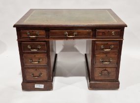 Mahogany pedestal desk, the central drawer flanked by eight short drawers, with leather inset to