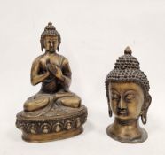 Modern bronze model of a seated Buddha, 28cm high and another of a Buddha head, 23cm high (2)