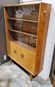 Mid-century burrwood veneer display cabinet with two sliding glass doors opening to reveal two