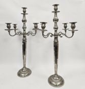 Pair of modern silvered four-branch candelabra on tapering octagonal stems and circular feet, 88cm