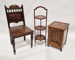 Victorian mahogany coal purdonium, the front with carved feathered details, raised on turned legs,