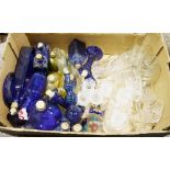 Collection of blue glass cork topped bottles in varying shapes and sizes, blue glass candlesticks, a