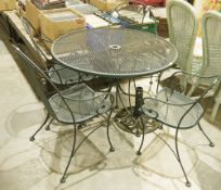 Metal black painted garden table, four chairs and parasol base