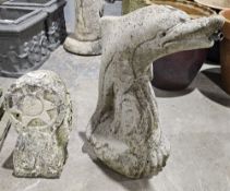 Composite stone water fountain in the form of a leaping dolphin and a composite stone sun headed