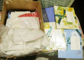 Box of fabric including unopened packs of Laura Ashley pillowcases, etc