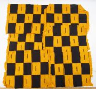 Kente fabric, 6 table mats, a table runner and six coasters in orange and black squares with