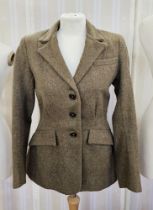 1940's/50's green and brown wool hacking jacket with fitted waist and side flap pockets, a split