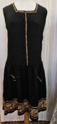 Black silk 1920's dress labelled 'Brands Limited of Belfast' with embroidered hem, embroidered