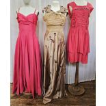 Three 1950's evening gowns to include a pale coffee-coloured satin evening gown with chiffon