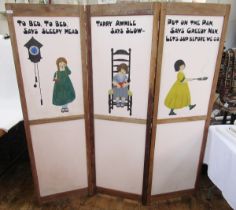 A vintage folding wooden screen in three panels, painted on one side with nursery rhymes and