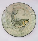 Adrian Brough (b. 1962) a large studio pottery platter decorated with a carp amongst reeds, signed