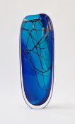 Cased blue art glass vase with red net pattern, indistinctly signed Bruce Marks to the base, 34.