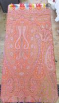 Large wool paisley shawl with tasselled ends in reds, blues, pinks, green and yellow, with black and