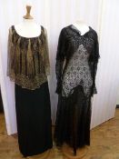 1920'S/'30's black evening dress with a net, gold thread embroidered cape, falling from the