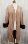 1940's pale peach duster coat with mink cuffs to the sleeves, a green crepe dress pin tuck pleats