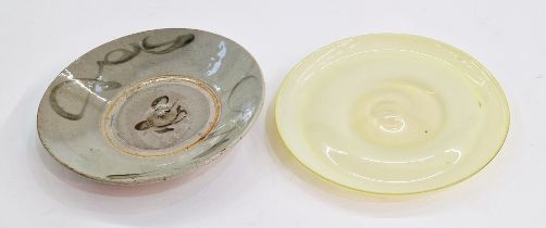 A studio pottery bowl with swirl decoration on grey ground, indistinct mark to base together with