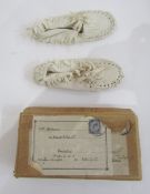 Pair child's cream leather moccasins, 1920's, in original packing case, and a pair raffia
