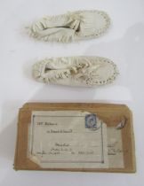 Pair child's cream leather moccasins, 1920's, in original packing case, and a pair raffia