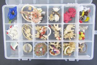 Quantity 1920's/30's and later plastic, bakelite and other brooches, charms and earrings