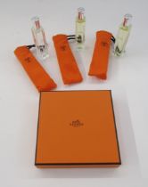 Set of three Hermes eau de toilette natural spray bottles, each in orange bag, 15ml, 'Le Jardin de