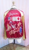 A 1950's souvenir reversible silk embroidered bomber jacket with Japanese and American flags, eagles