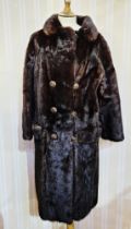 Full-length black mink coat circa 1980's, half-belt, with gilt and faux amber button detail,