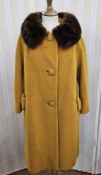 A 1950's yellow wool coat, labelled  'Lilli Ann's Petite' with a brown mink collar, three button