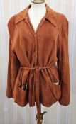 A vintage 1940s ginger coloured suede jacket, front pockets three button fastening with suede tie