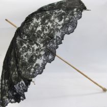 Late 19th/early 20th century parasol with a carved wooden handle as bamboo, black lace with a