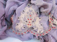 Piece of grey chiffon fabric with silver thread, red bead and black embroidered panels, the fabric